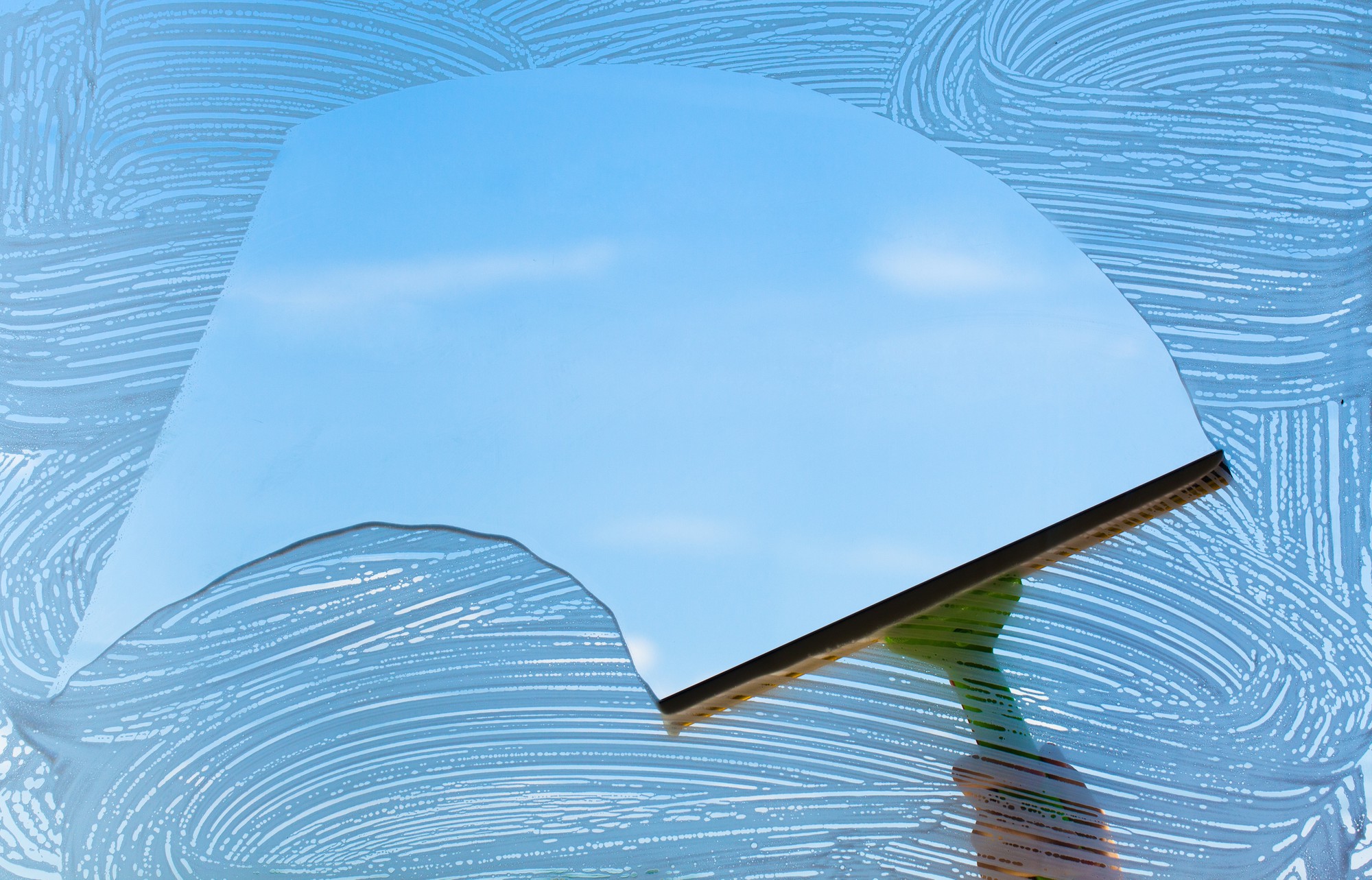 How Window Washing Can Protect Your Glass from Long-Term Damage