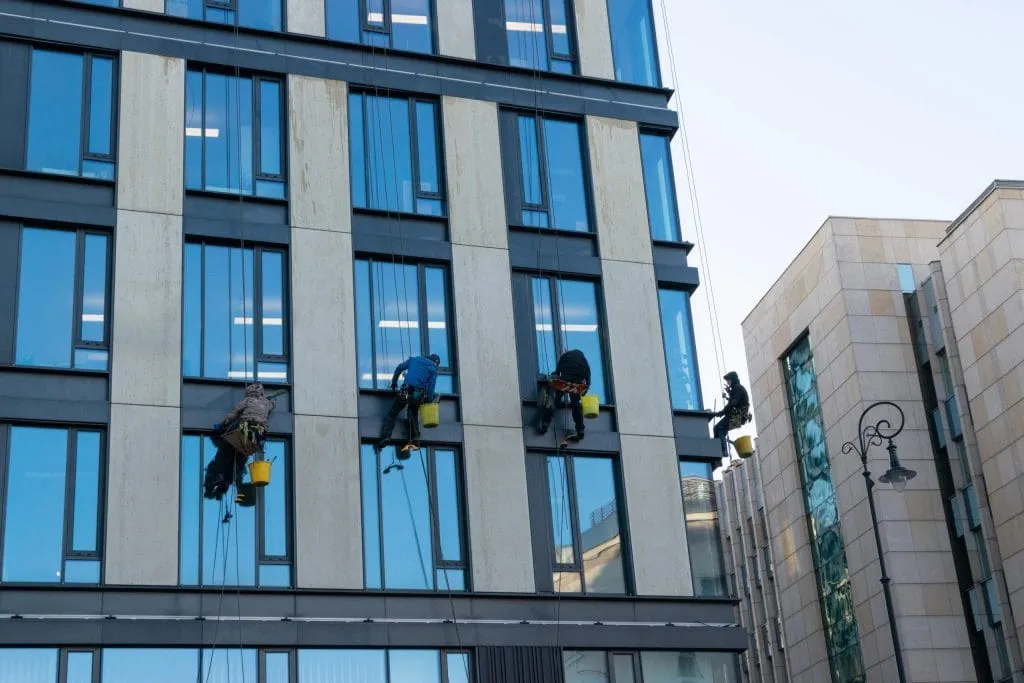 window cleaners working on commercial building