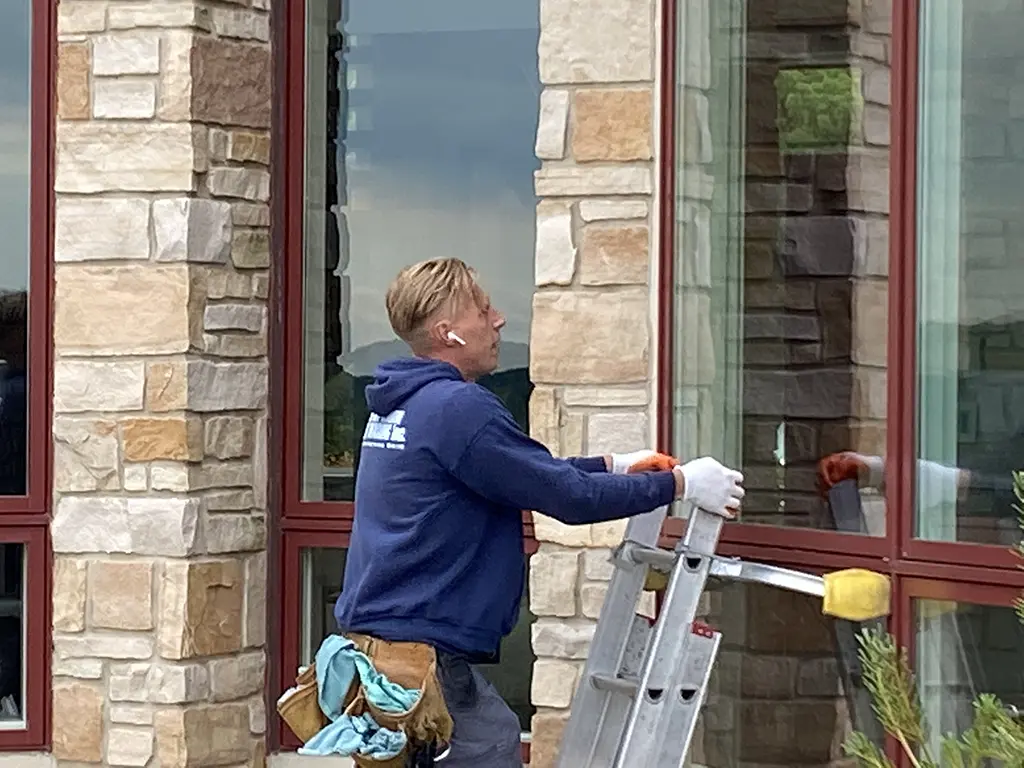 window cleaner on the ladder