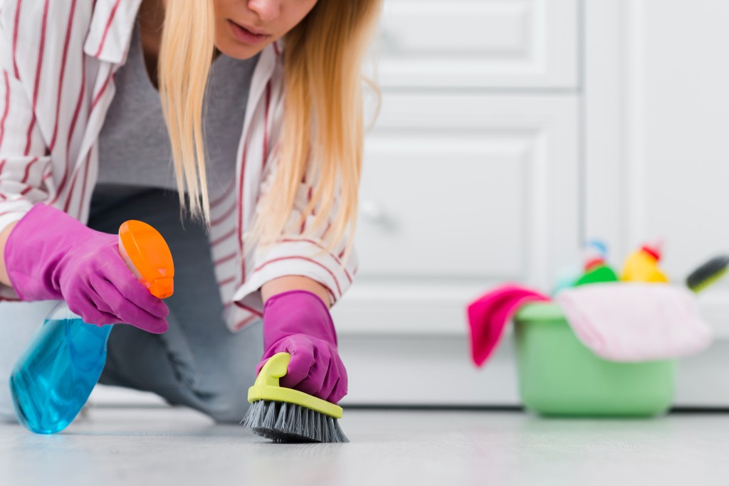 person cleaning floor
