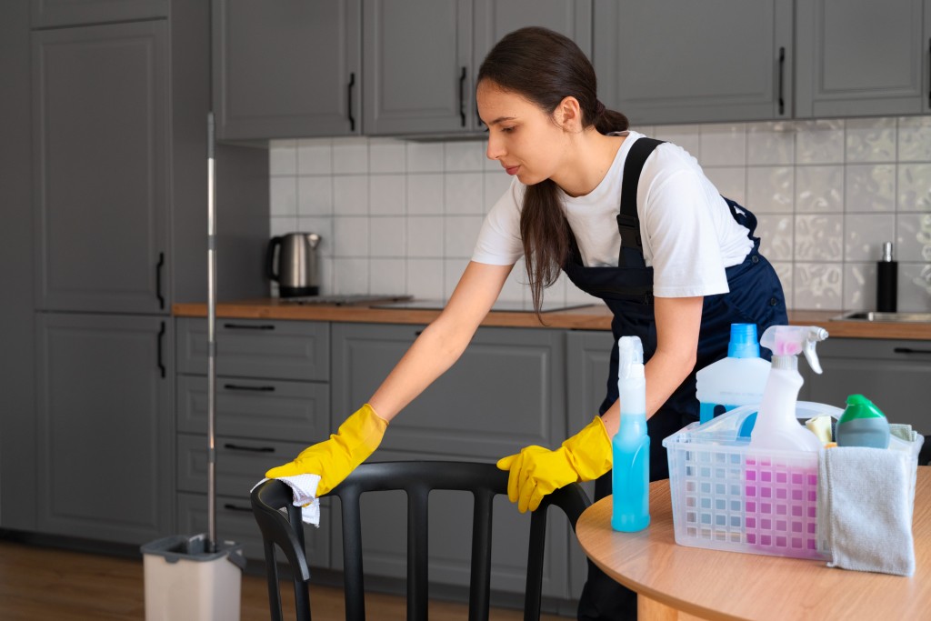 woman cleaning a chair