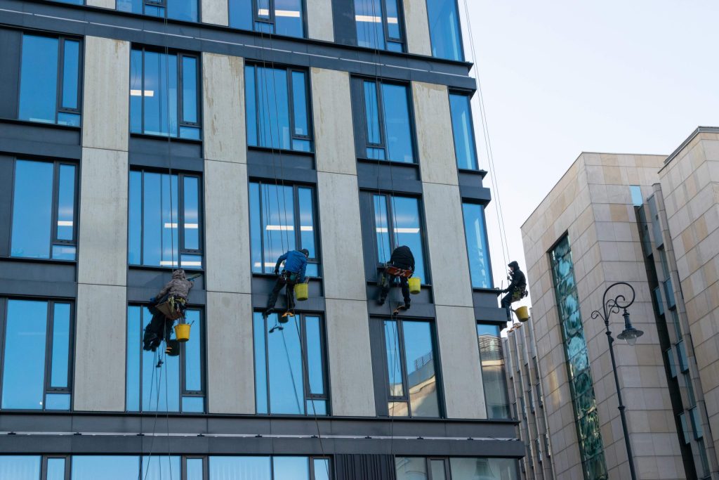 window cleaners working on commercial building